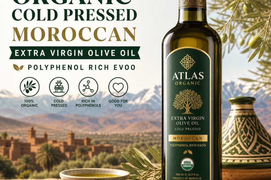 Bottle of Atlas organic cold pressed Moroccan extra virgin olive oil with olives and a Moroccan landscape backdrop
