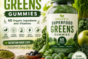 Bottle of organic superfood greens gummies surrounded by fresh fruits, vegetables, and leaves on white background
